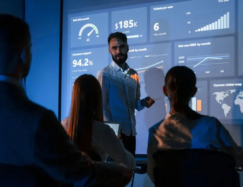 A man presenting on a screen.