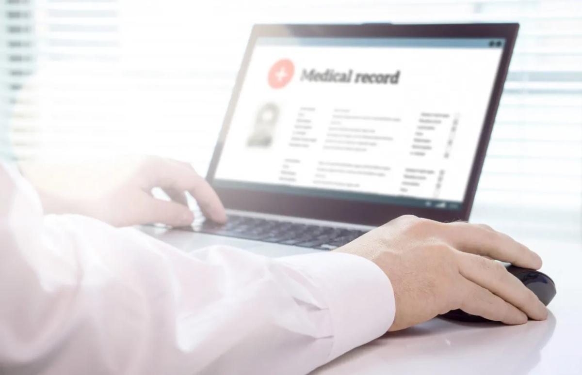 Electronic medical record displayed on laptop screen.
